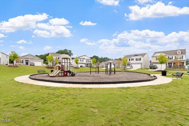 a view of a swimming pool with a yard