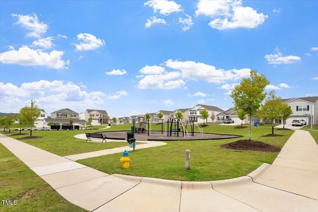 a view of a big yard with a swimming pool
