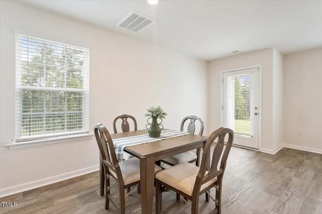 a view of a dining room with furniture window and outside view