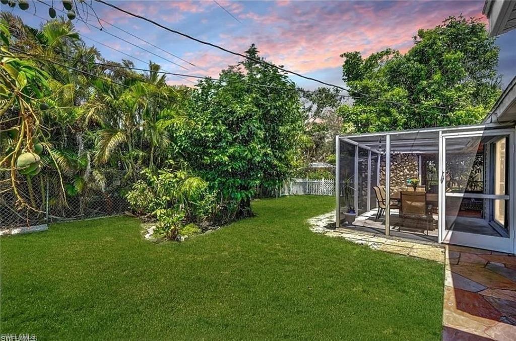 2047 Harbor Lane Naples, FL 34104 - Photo 18 of 27 Fenced backyard featuring a sunroom and a patio area