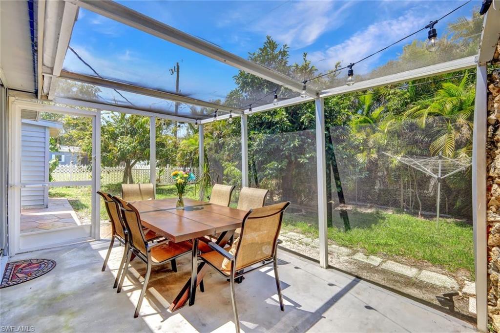 2047 Harbor Lane Naples, FL 34104 - Photo 22 of 27 Sunroom / solarium with outdoor dining area