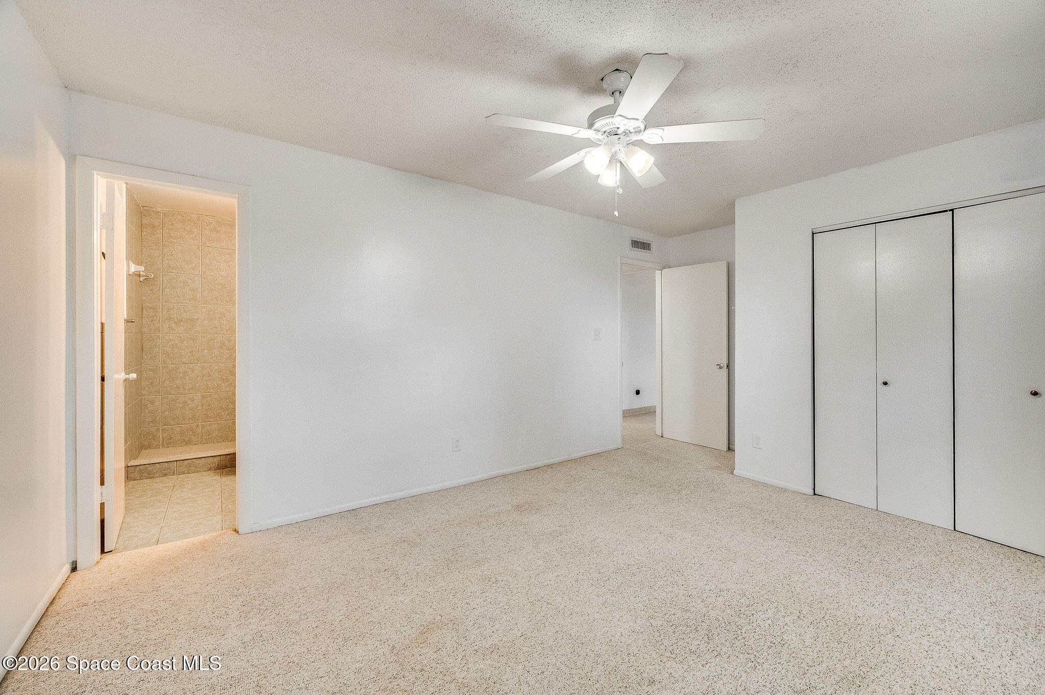 4304 London Town Road, Unit D224 Titusville, FL 32796 - Photo 12 of 32 a view of an empty room and chandelier fan