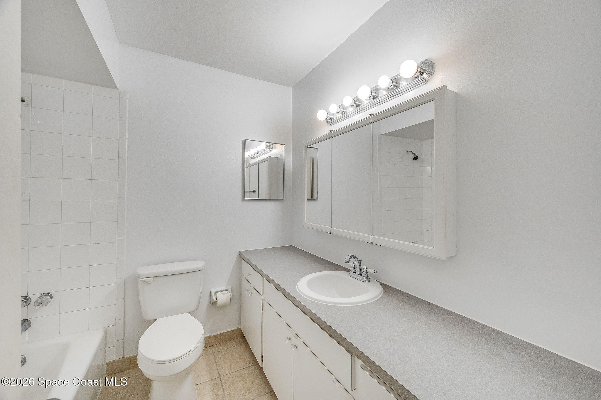 4304 London Town Road, Unit D224 Titusville, FL 32796 - Photo 18 of 32 a bathroom with a sink toilet and shower