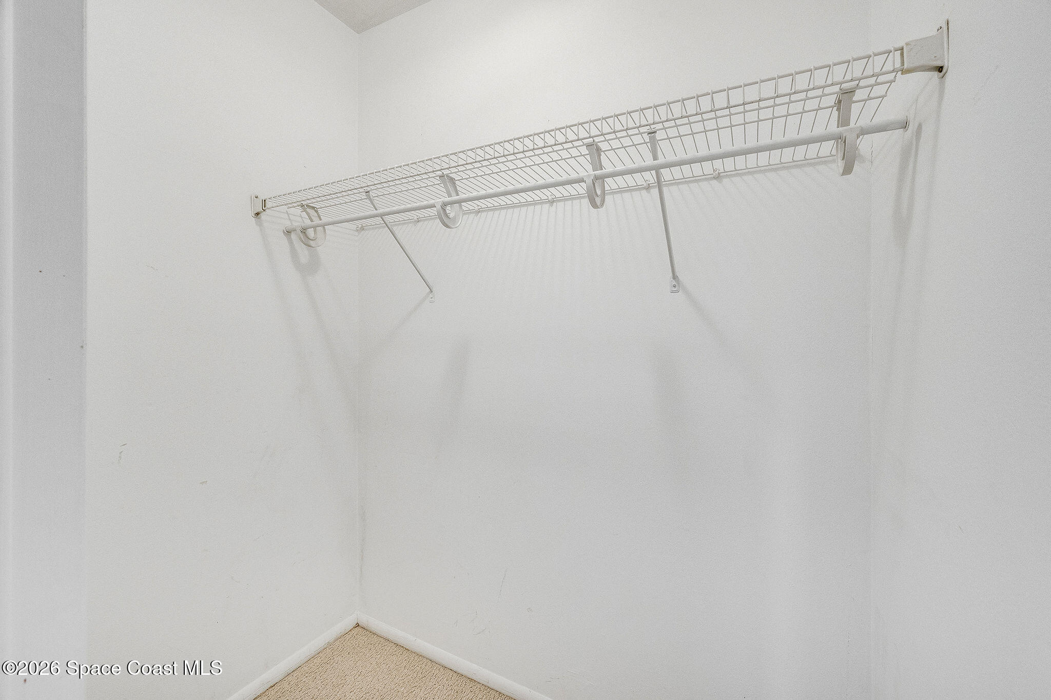 4304 London Town Road, Unit D224 Titusville, FL 32796 - Photo 21 of 32 a view of a room with racks on the wall