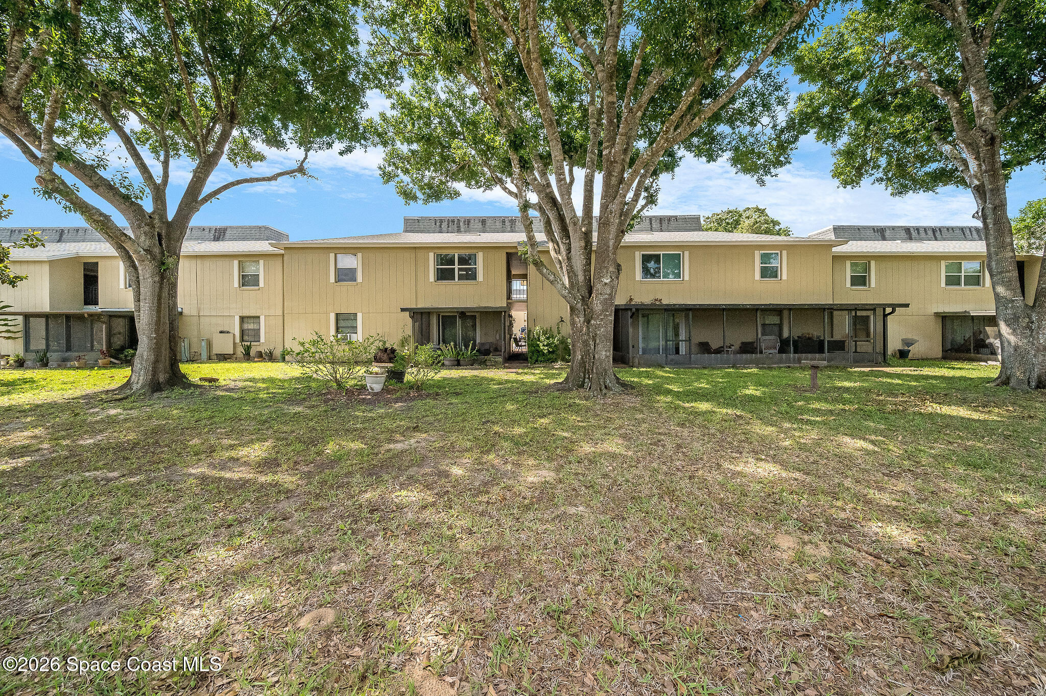 4304 London Town Road, Unit D224 Titusville, FL 32796 - Photo 23 of 32 a view of a house with a yard