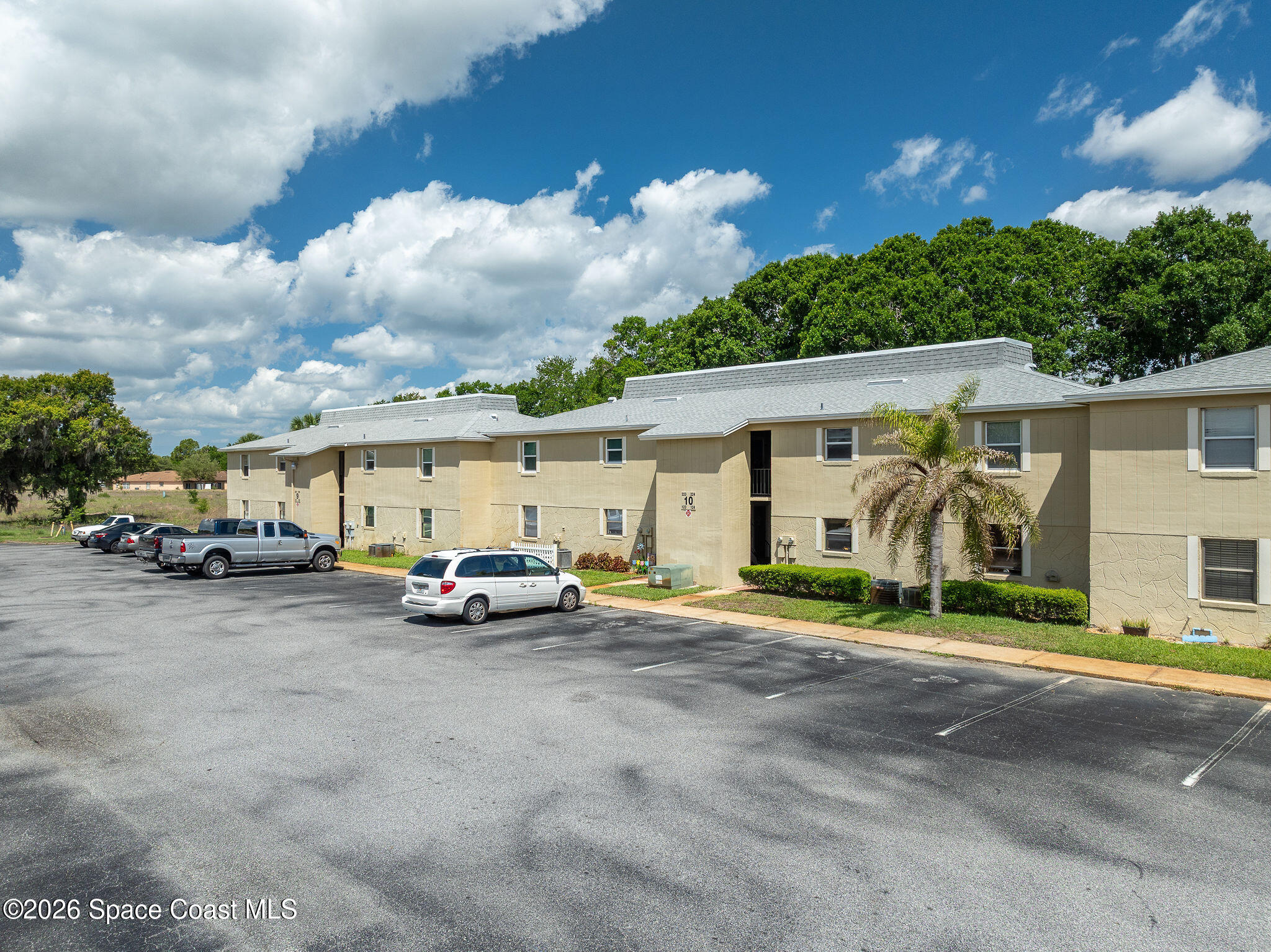 4304 London Town Road, Unit D224 Titusville, FL 32796 - Photo 28 of 32 a view of a cars parked in front of a house