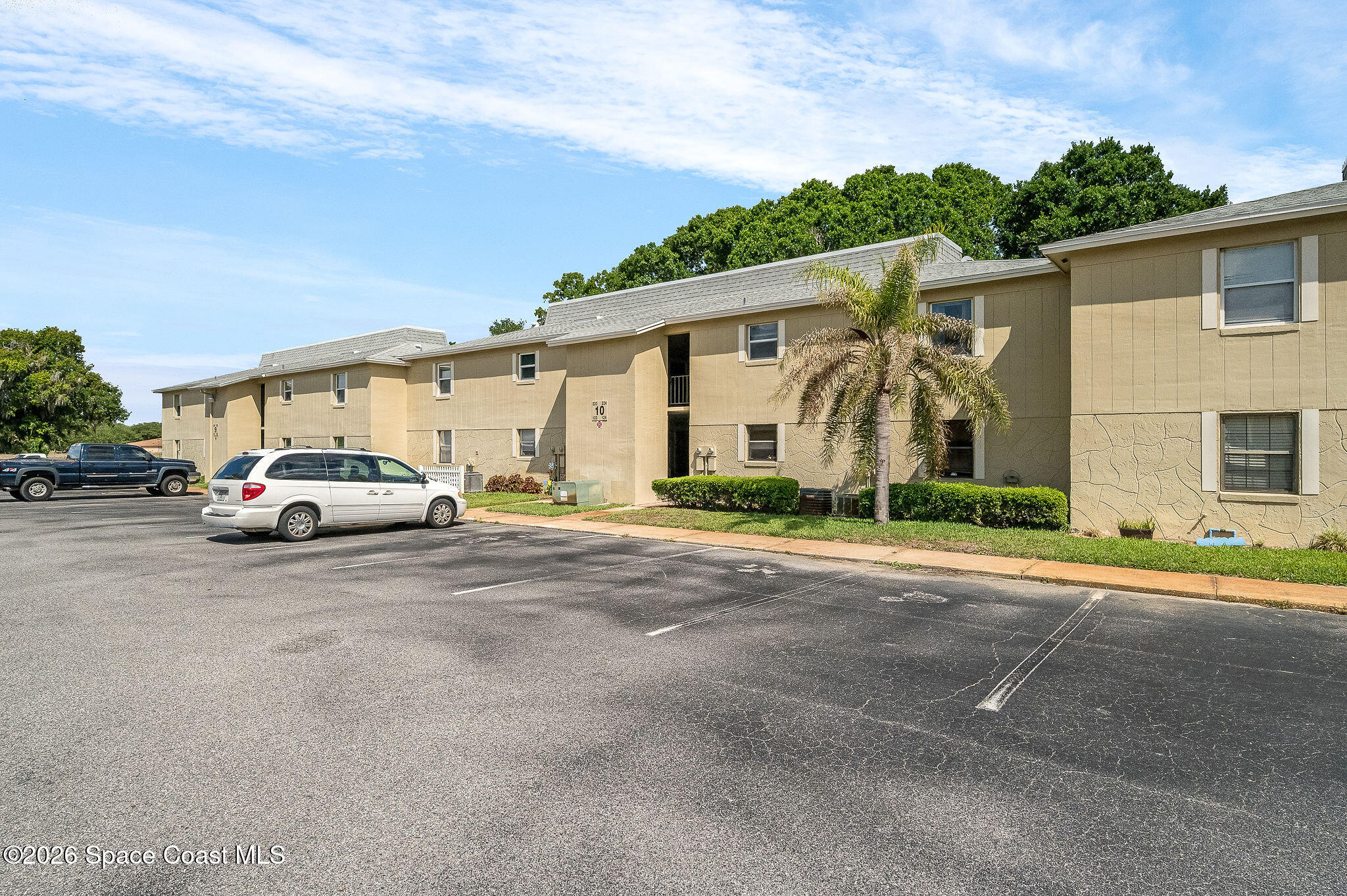 4304 London Town Road, Unit D224 Titusville, FL 32796 - Photo 29 of 32 a car parked on the side of the road