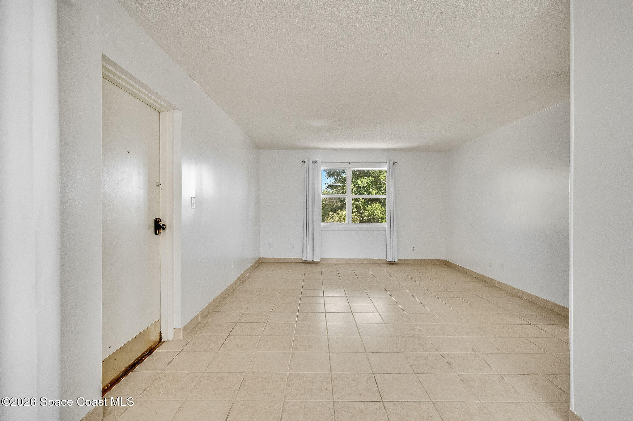 4304 London Town Road, Unit D224 Titusville, FL 32796 - Photo 4 of 32 an empty room with windows