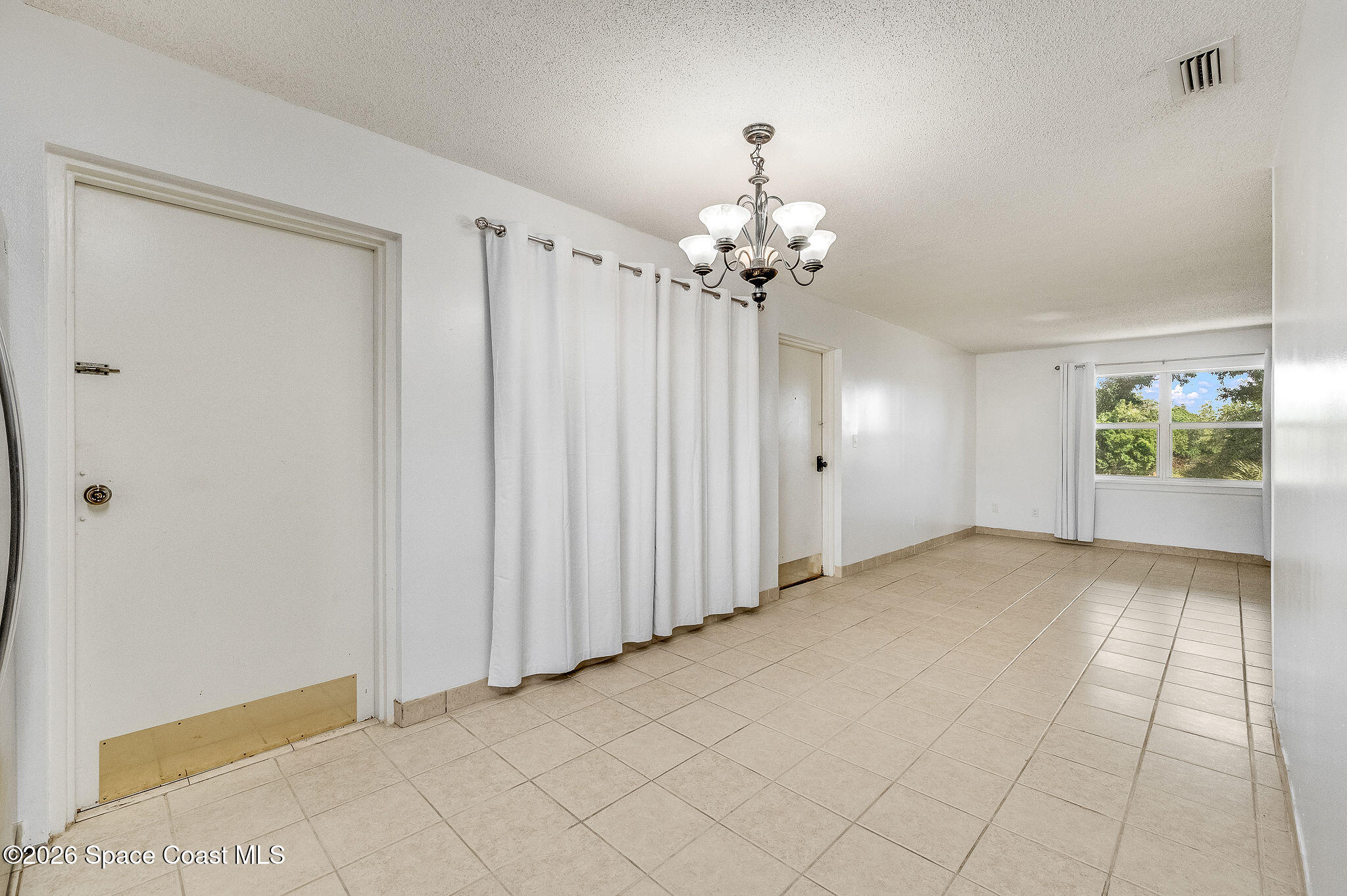 4304 London Town Road, Unit D224 Titusville, FL 32796 - Photo 5 of 32 a view of an empty room with a window