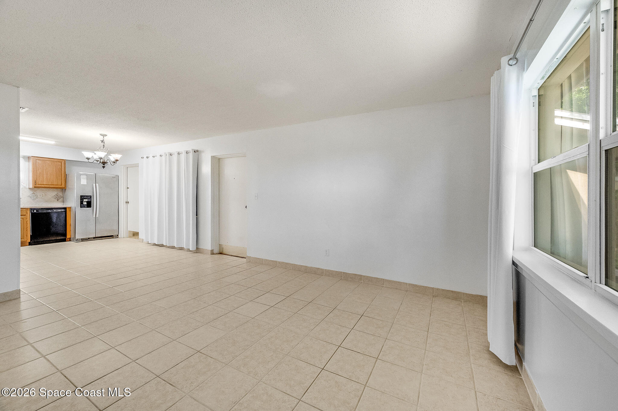 4304 London Town Road, Unit D224 Titusville, FL 32796 - Photo 10 of 32 a view of an empty room with a window