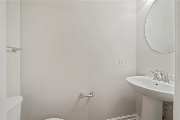 a view of a kitchen with wooden floor and a kitchen
