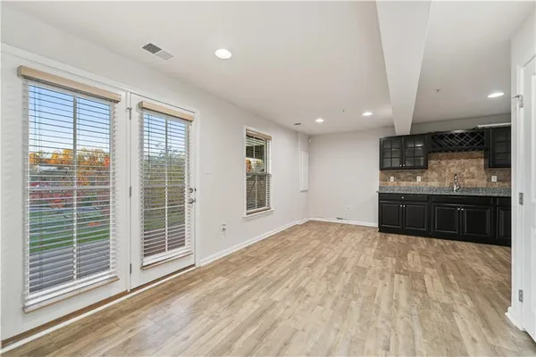 a view of a kitchen with a sink and a refrigerator
