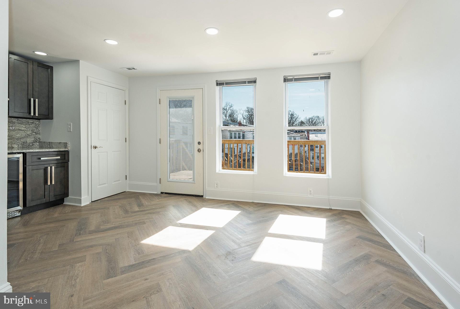214 Upshur Street Northwest Washington, DC 20011 - Photo 17 of 50 Eat in kitchen leading to the deck