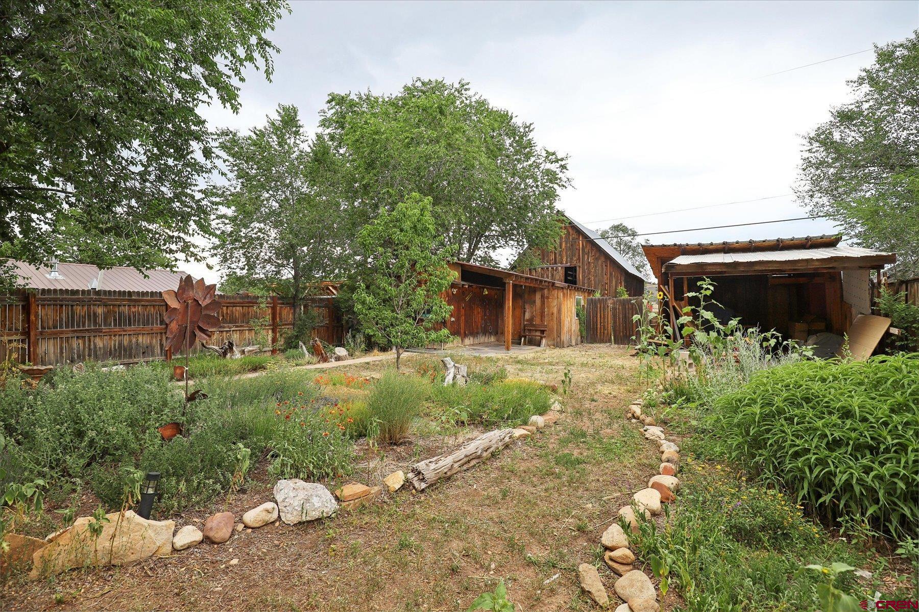 438 Bauer Avenue Mancos, CO 81328 - Photo 15 of 30 a house view with a backyard space
