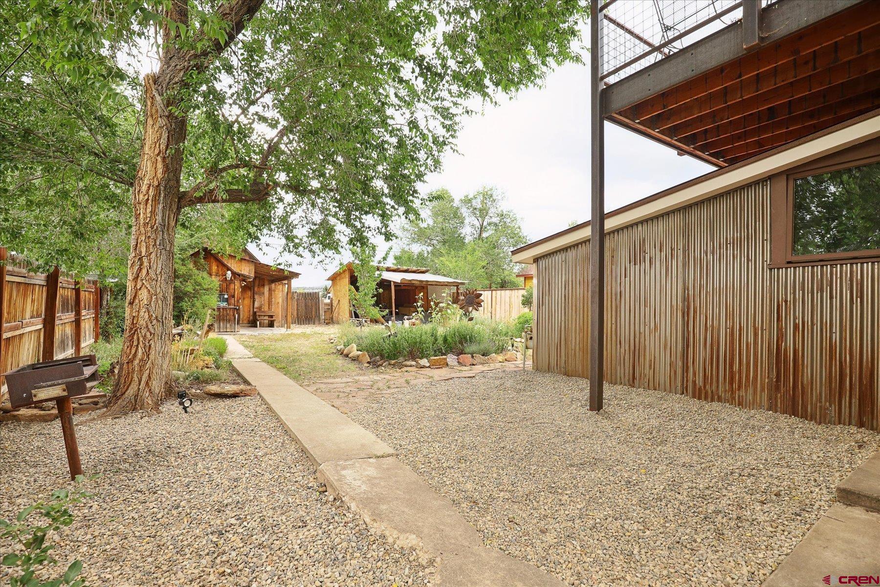 438 Bauer Avenue Mancos, CO 81328 - Photo 16 of 30 a view of a house with a yard