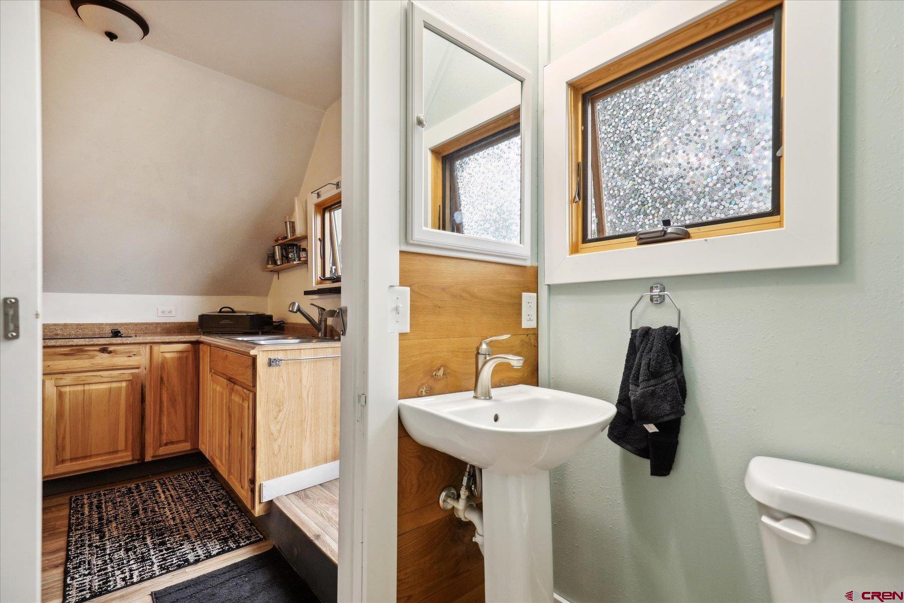 438 Bauer Avenue Mancos, CO 81328 - Photo 28 of 30 a bathroom with a sink and a mirror
