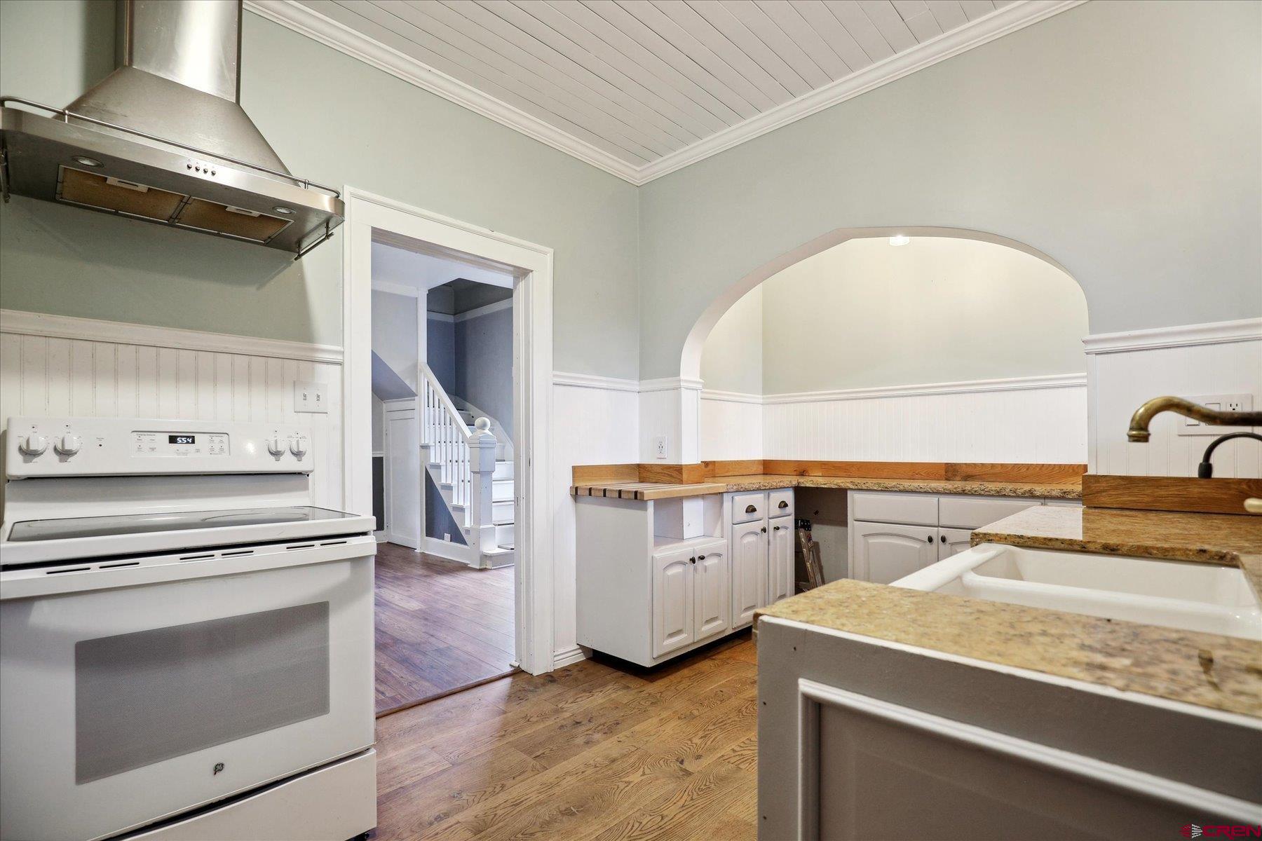 438 Bauer Avenue Mancos, CO 81328 - Photo 30 of 30 a kitchen with a stove and a sink