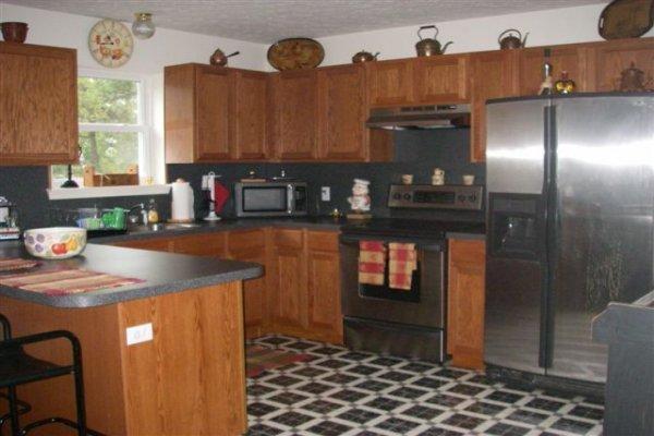 763 Sage Road Long Pond, PA 18334 - Photo 2 of 8 a kitchen with stainless steel appliances granite countertop a refrigerator a sink and dishwasher