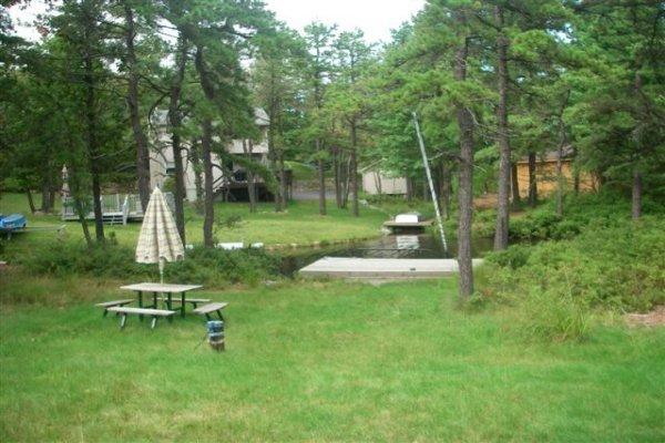 763 Sage Road Long Pond, PA 18334 - Photo 5 of 8 a view of a table and chairs in the garden