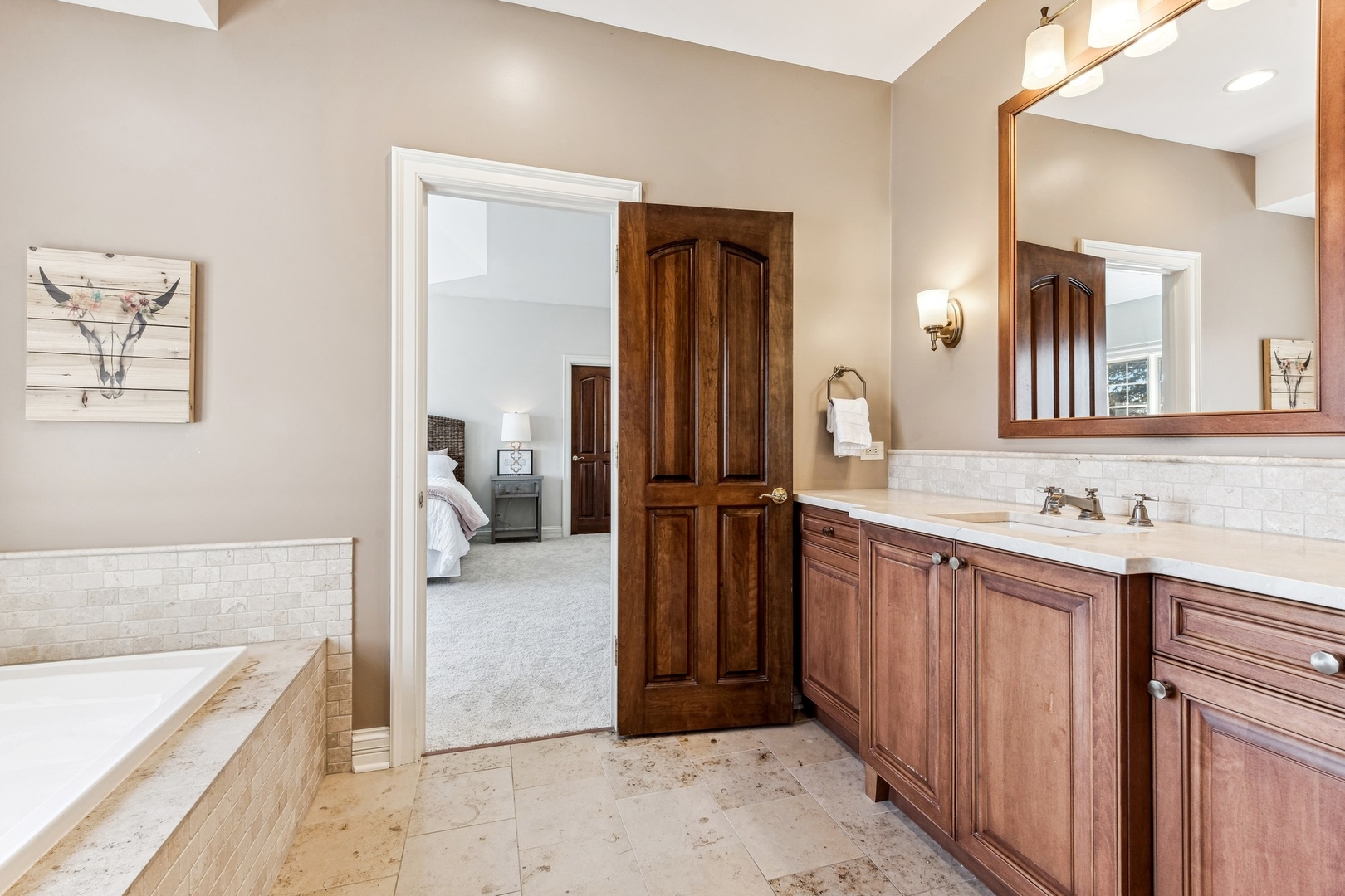 1334 Brandywine Road Libertyville, IL 60048 - Photo 17 of 32 a bathroom with a tub a sink and a mirror