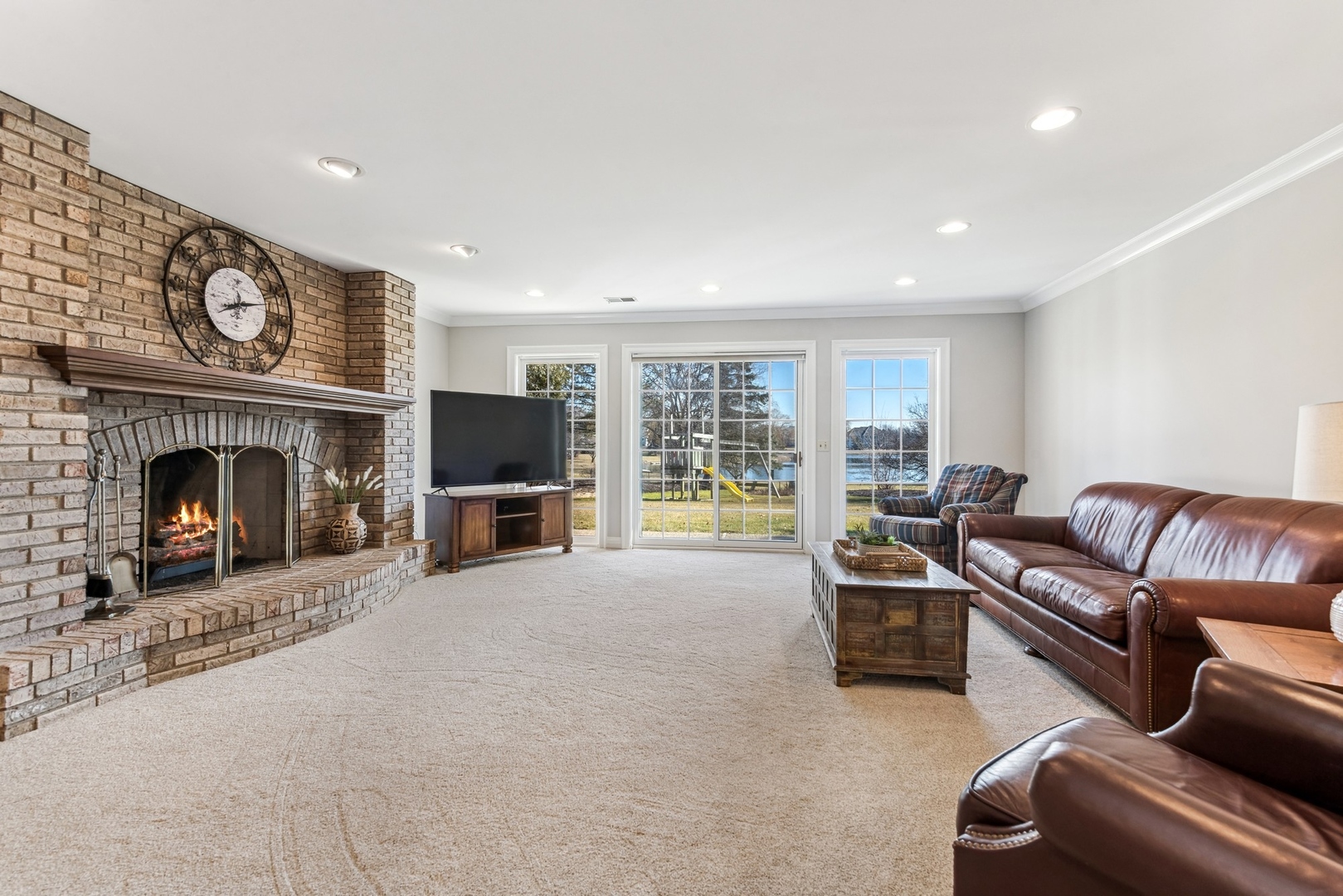 1334 Brandywine Road Libertyville, IL 60048 - Photo 22 of 32 a living room with furniture a flat screen tv and a fireplace