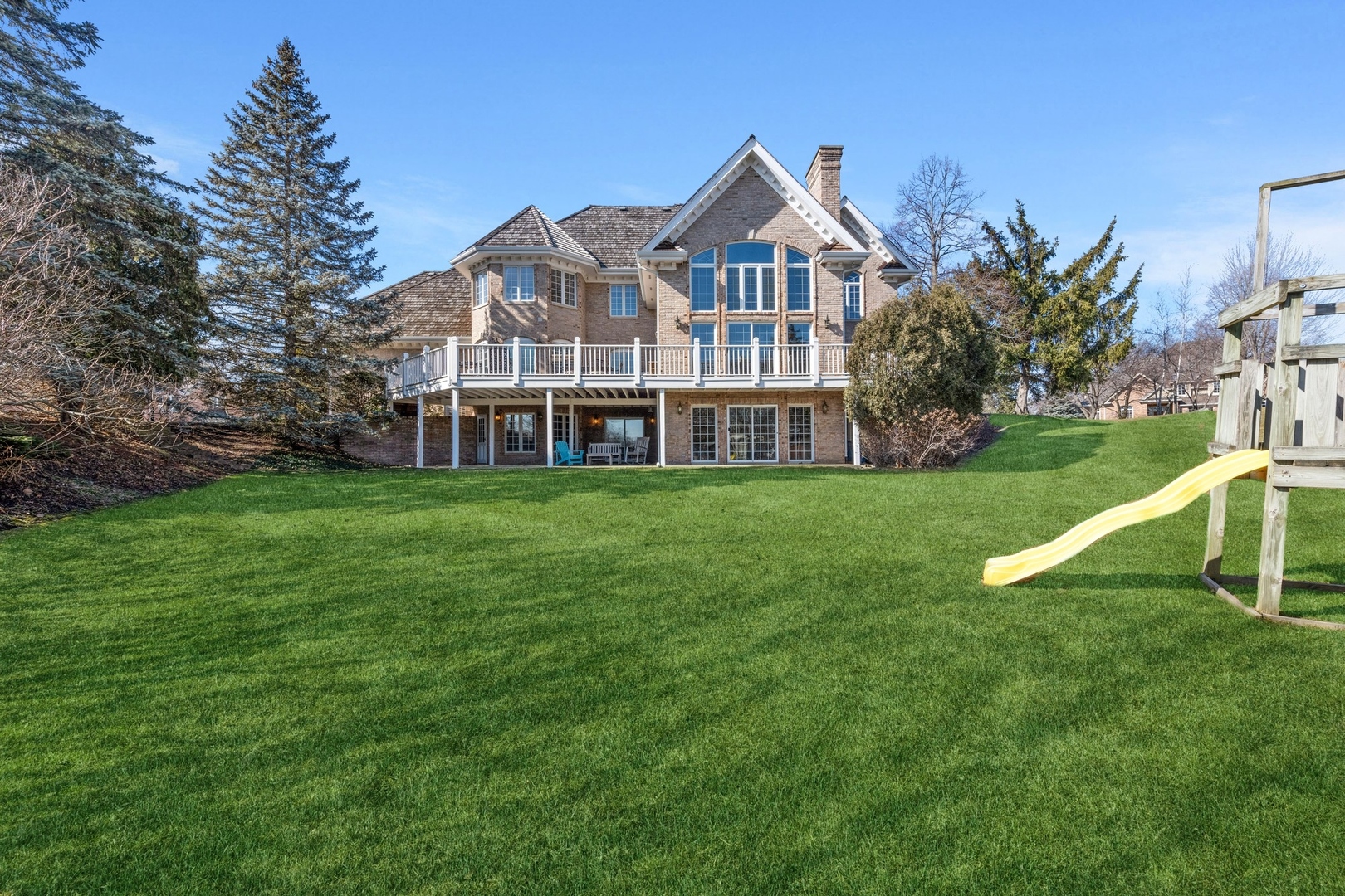 1334 Brandywine Road Libertyville, IL 60048 - Photo 27 of 32 a view of a house with a big yard and large trees