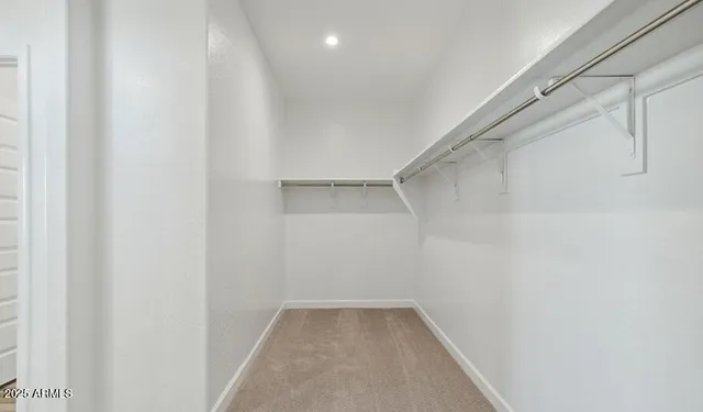 an empty room with a empty space and windows