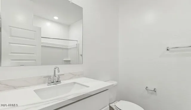 a bathroom with a sink and shower