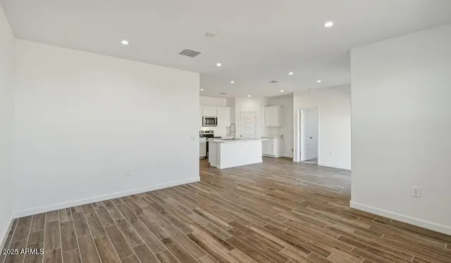 a view of a kitchen with wooden floor