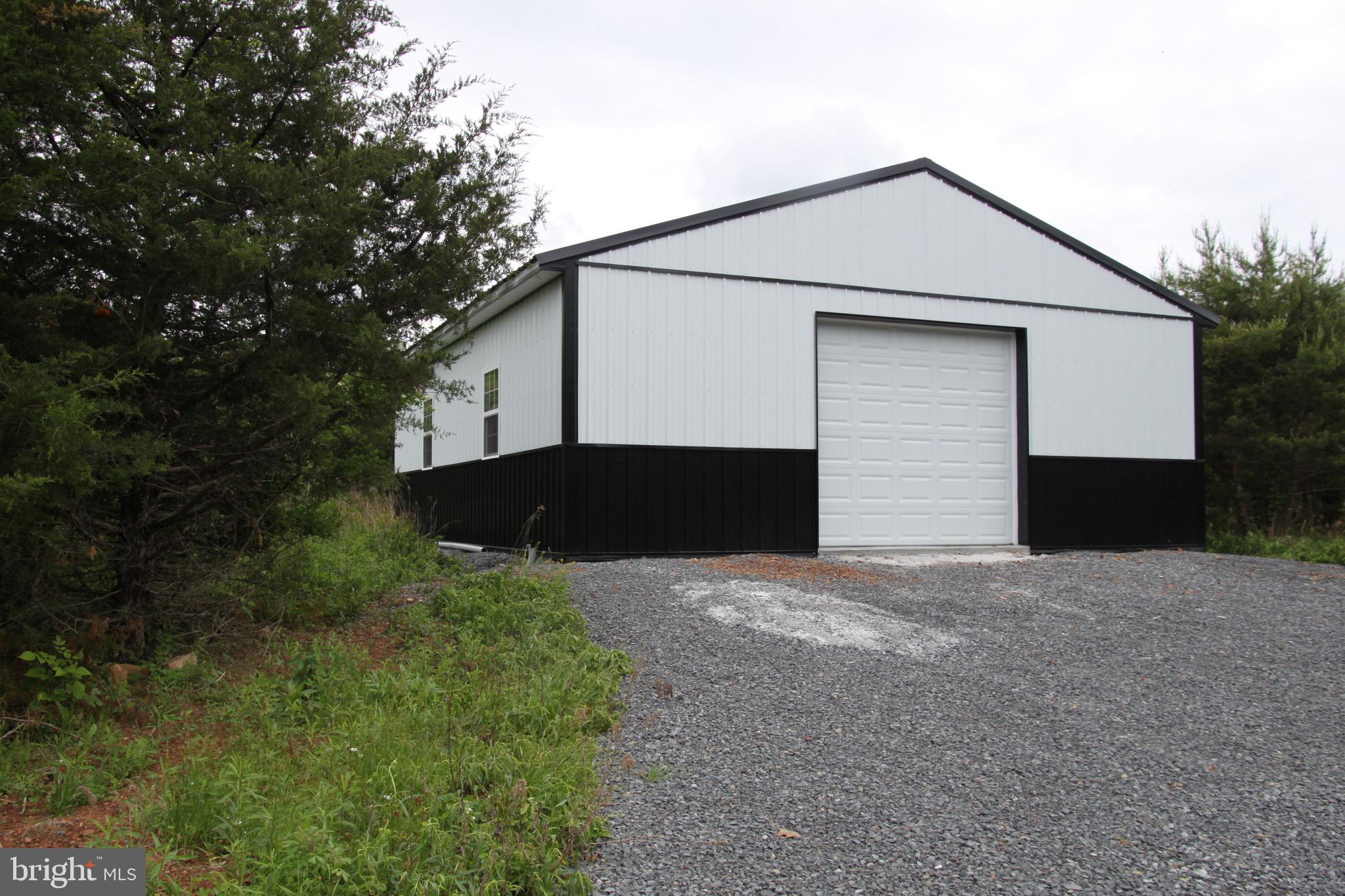 Slabtown Road Hancock, MD 21750 - Photo 9 of 20 a front view of house with yard and trees