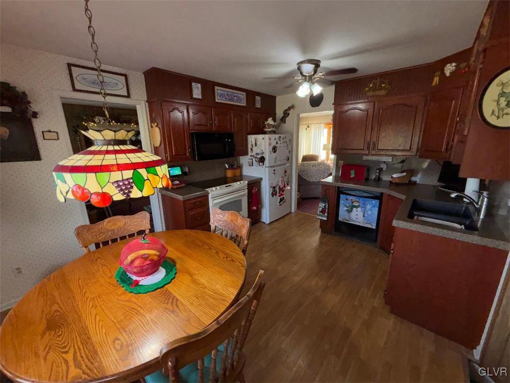 1494 Teels Road Pen Argyl, PA 18072 - Photo 6 of 12 a view of a dining room with furniture and a flat screen tv