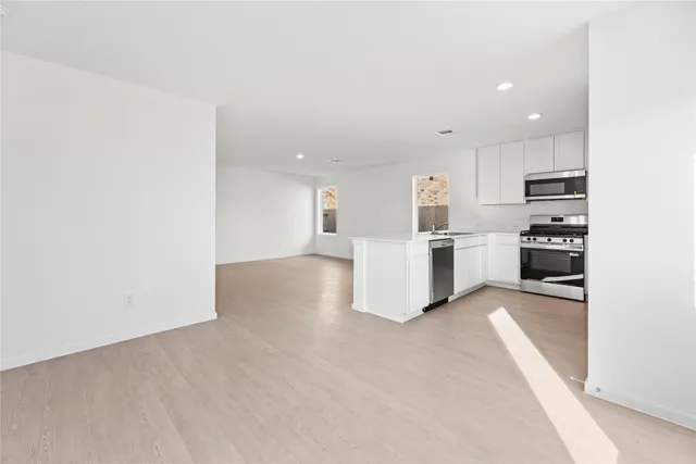 a view of kitchen with wooden floor