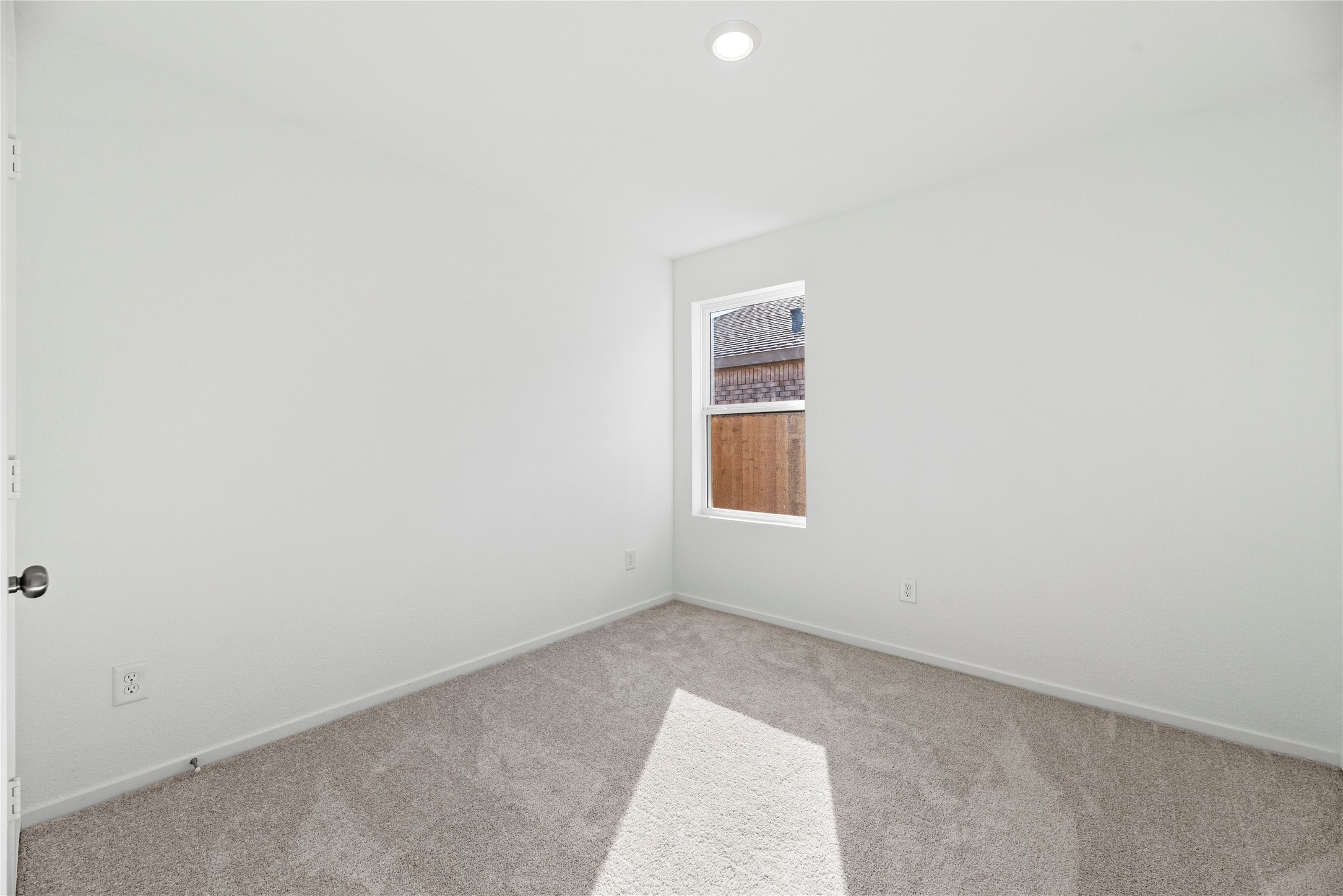 16222 Rustic Prairie Drive Hockley, TX 77447 - Photo 7 of 16 a view of an empty room with a window