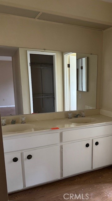 604 South Santa Fe Street, Unit 1 Hemet, CA 92543 - Photo 14 of 16 a bathroom with a sink and mirror