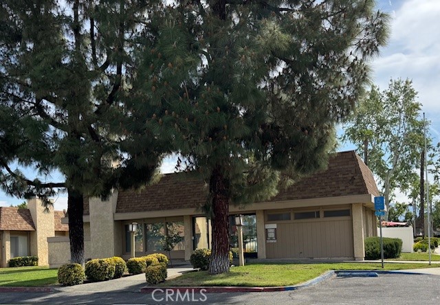 604 South Santa Fe Street, Unit 1 Hemet, CA 92543 - Photo 15 of 16 a front view of a house with a garden and trees