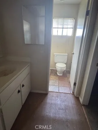 a kitchen with a refrigerator and a stove top oven