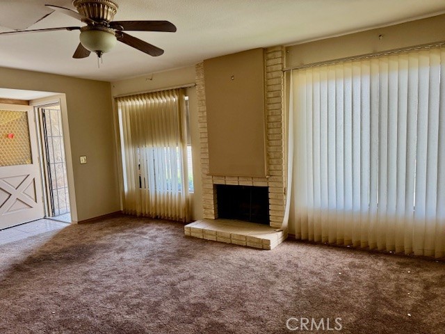 604 South Santa Fe Street, Unit 1 Hemet, CA 92543 - Photo 8 of 16 an empty room with a ceiling fan and a window