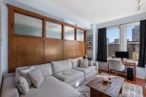 a living room with furniture and a window