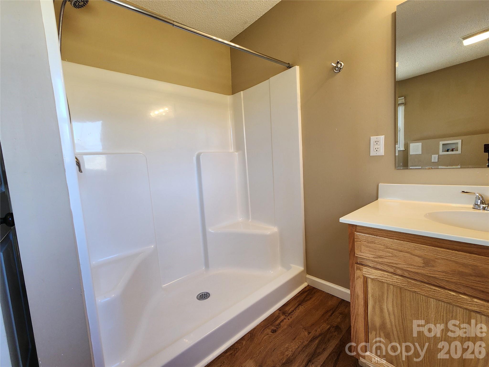 31 Stanley Street Candler, NC 28715 - Photo 11 of 22 a bathroom with a bath tub and a shower