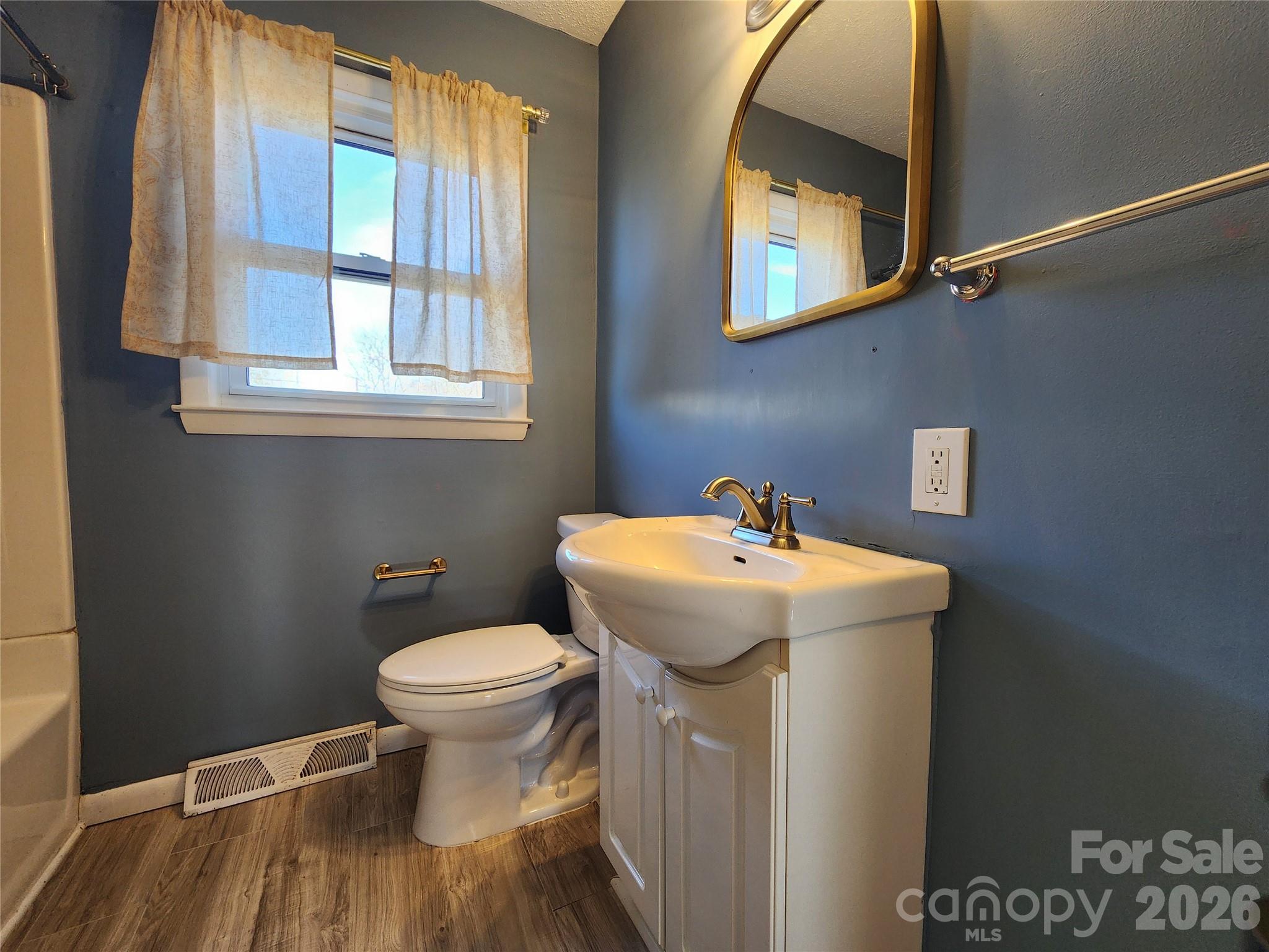 31 Stanley Street Candler, NC 28715 - Photo 16 of 22 a bathroom with a sink and a toilet