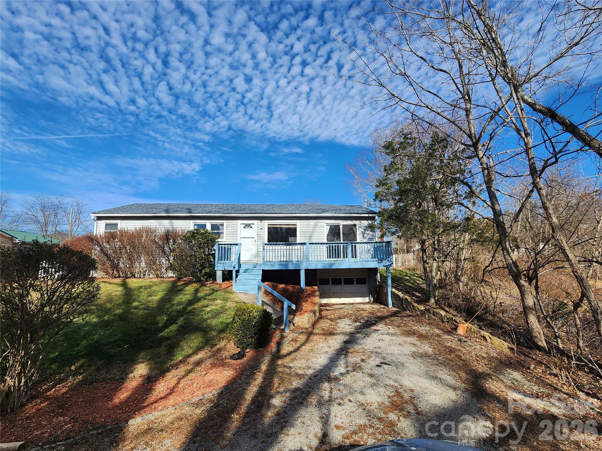 31 Stanley Street Candler, NC 28715 - Photo 3 of 22 a view of a house with backyard and sitting area