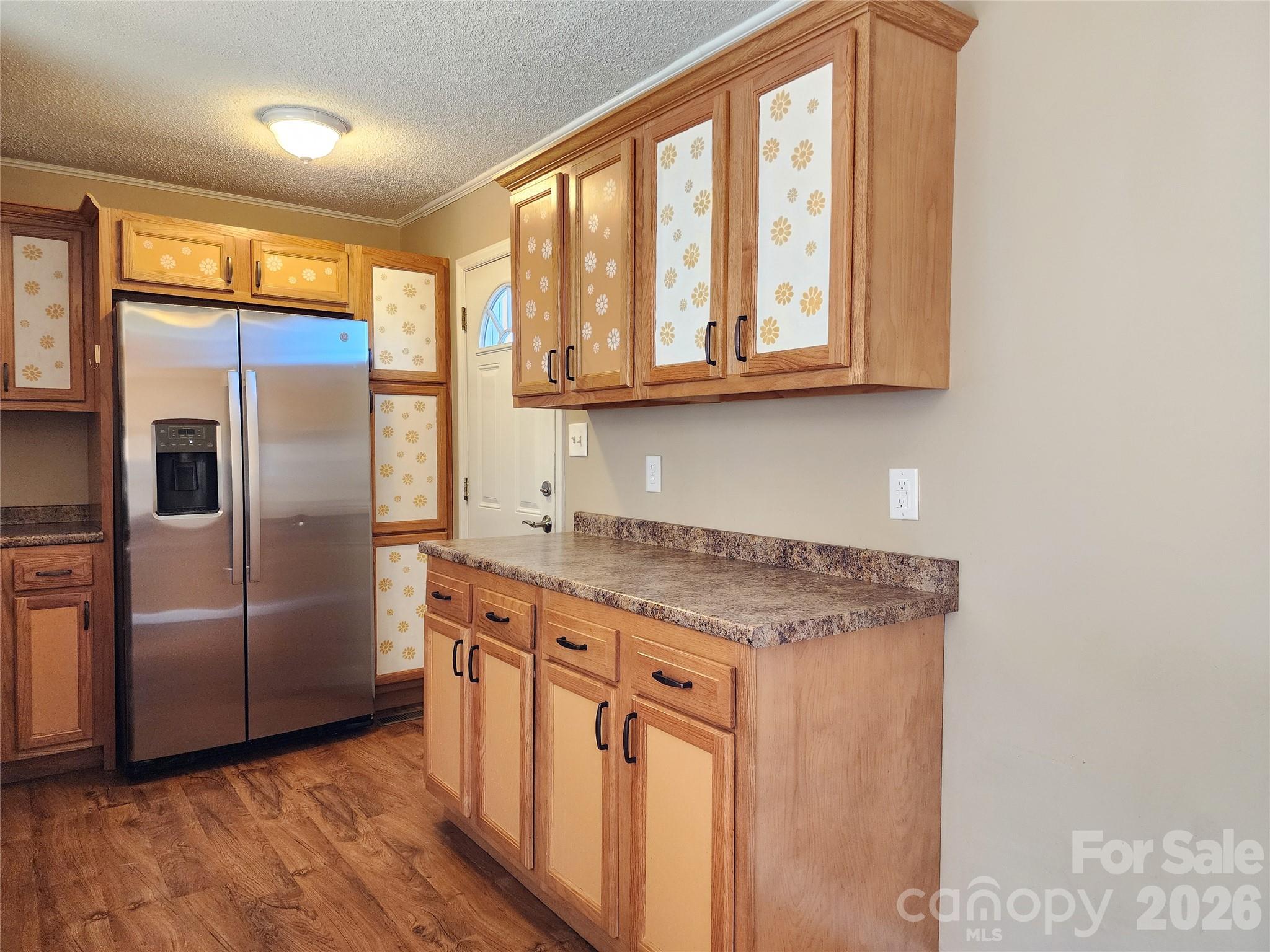 31 Stanley Street Candler, NC 28715 - Photo 9 of 22 a kitchen with stainless steel appliances granite countertop a refrigerator and a sink