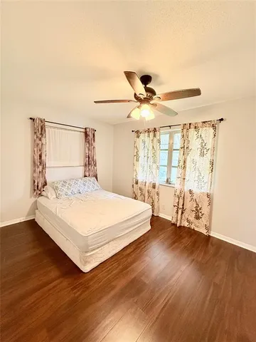 a large white bed in a white room