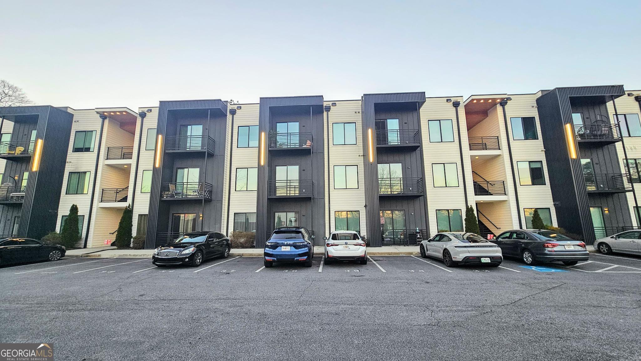 1155 Custer Avenue Southeast, Unit 101 Atlanta, GA 30316 - Photo 1 of 27 a car parked in front of a building