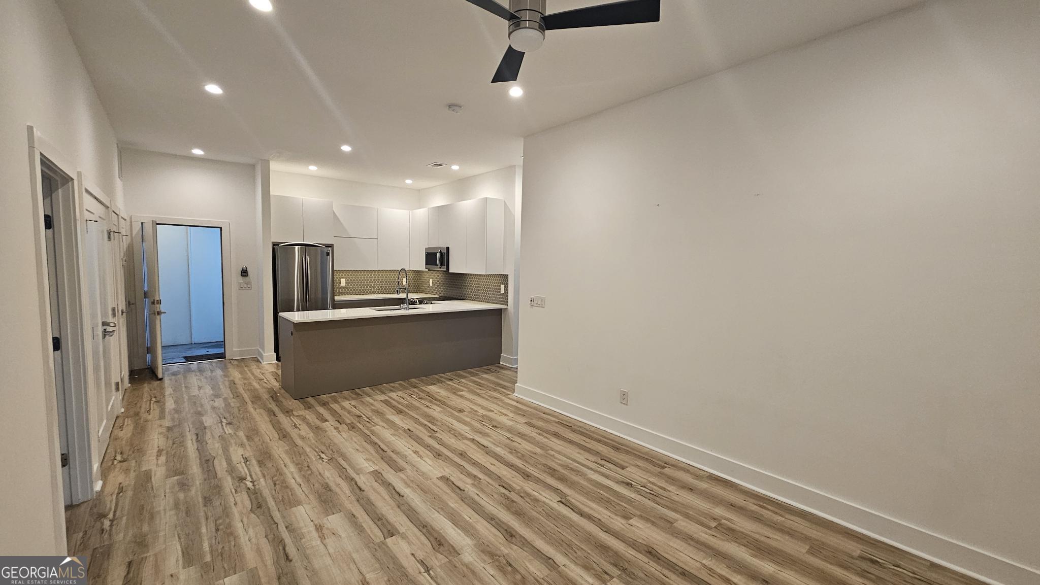 1155 Custer Avenue Southeast, Unit 101 Atlanta, GA 30316 - Photo 14 of 27 a kitchen with stainless steel appliances granite countertop a sink and cabinets