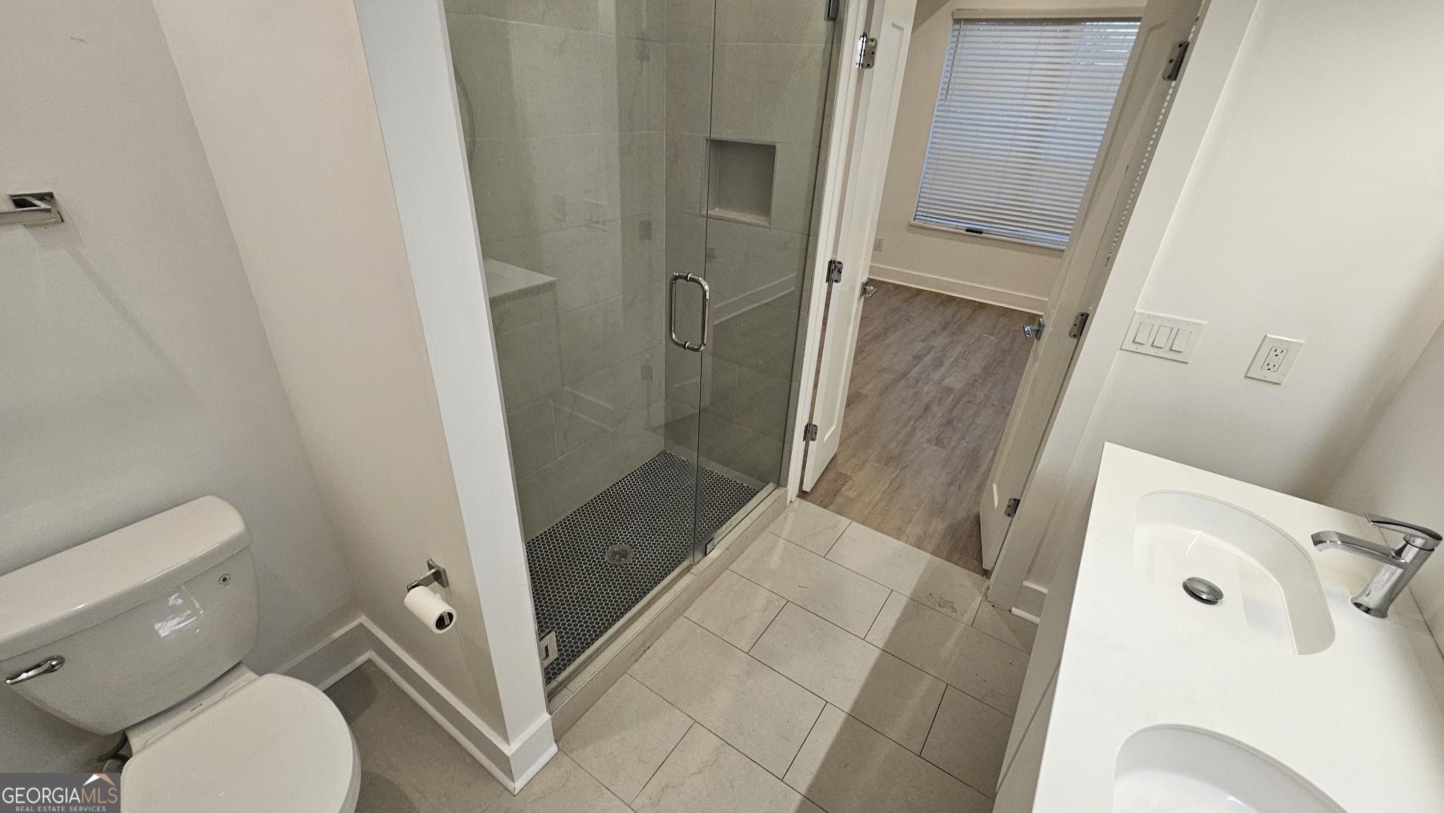 1155 Custer Avenue Southeast, Unit 101 Atlanta, GA 30316 - Photo 16 of 27 a bathroom with a shower and toilet