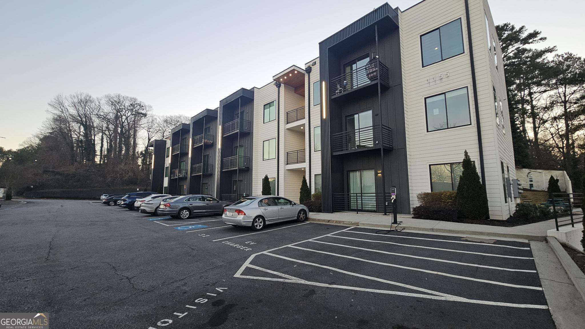 1155 Custer Avenue Southeast, Unit 101 Atlanta, GA 30316 - Photo 2 of 27 a building with view of car parked