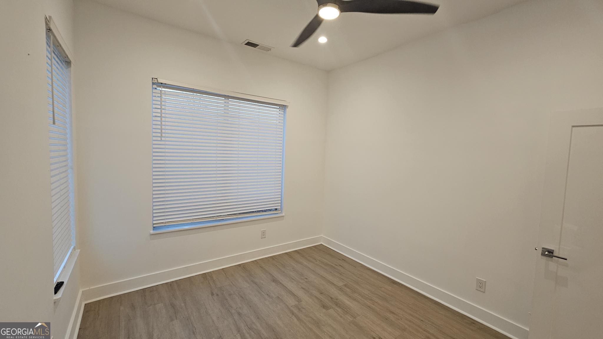1155 Custer Avenue Southeast, Unit 101 Atlanta, GA 30316 - Photo 24 of 27 an empty room with a window