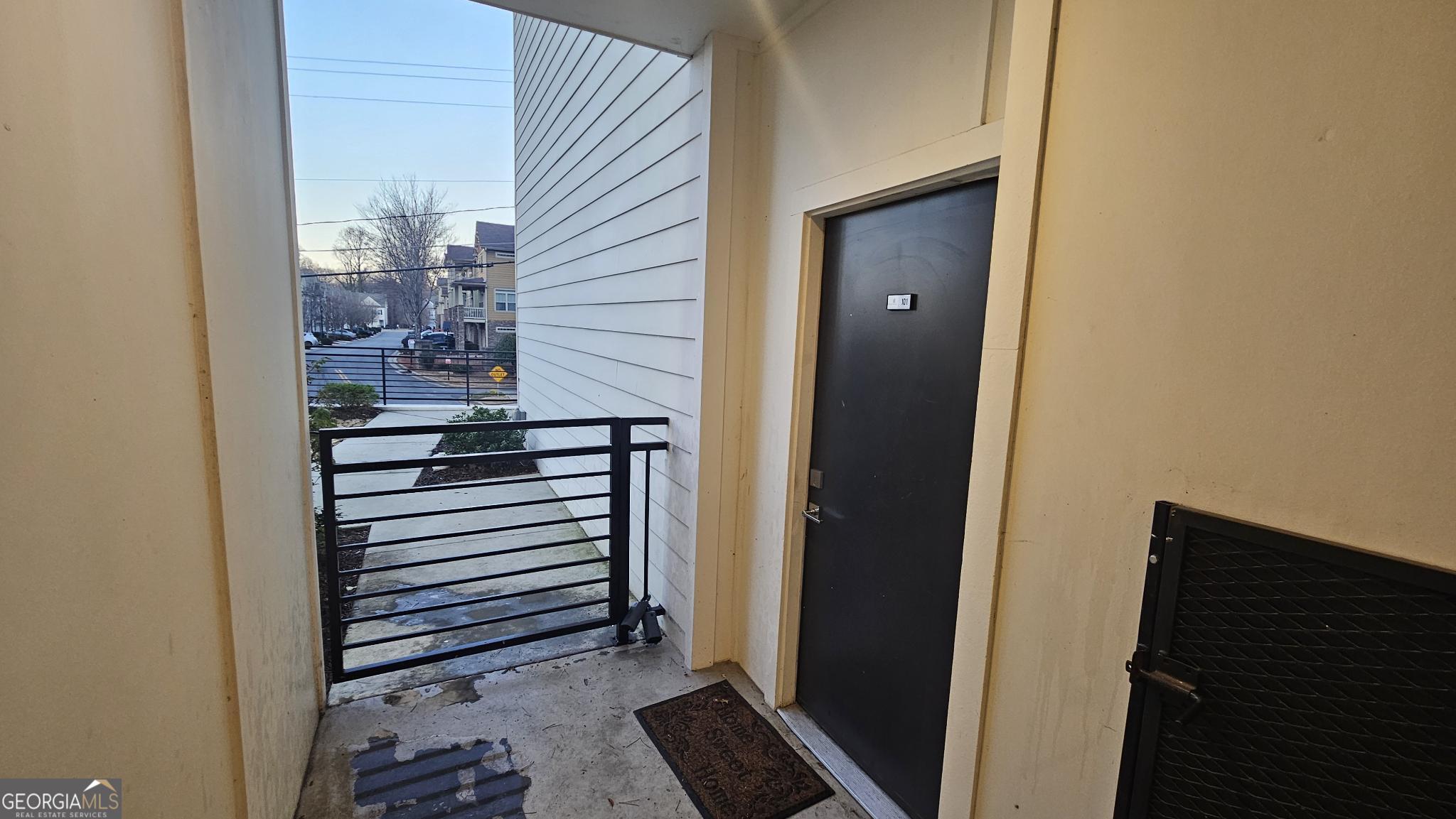 1155 Custer Avenue Southeast, Unit 101 Atlanta, GA 30316 - Photo 7 of 27 a view of a hallway with wooden floor and windows