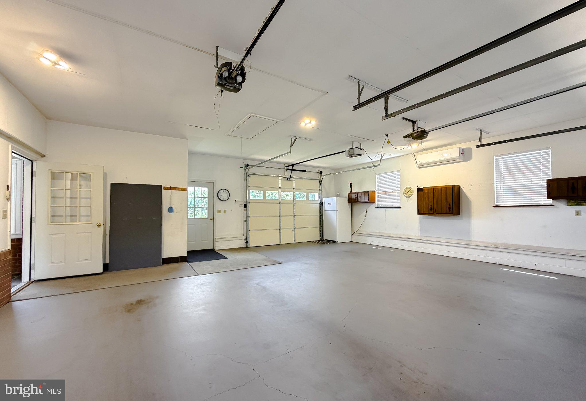 23230 Colton Point Road Avenue, MD 20609 - Photo 54 of 63 Spacious garage with ample storage.